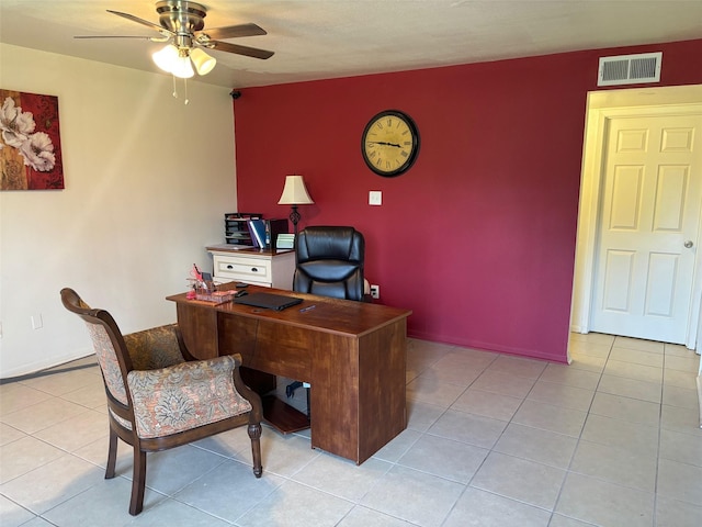 office area with a ceiling fan, visible vents, baseboards, and light tile patterned floors