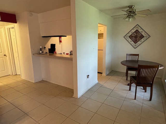 kitchen featuring ceiling fan and light tile patterned floors