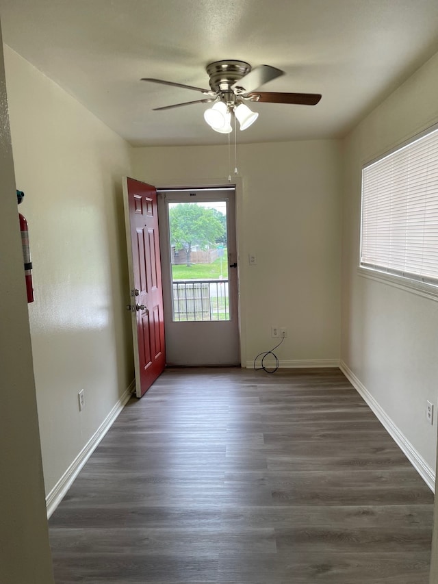 spare room with ceiling fan and hardwood / wood-style flooring