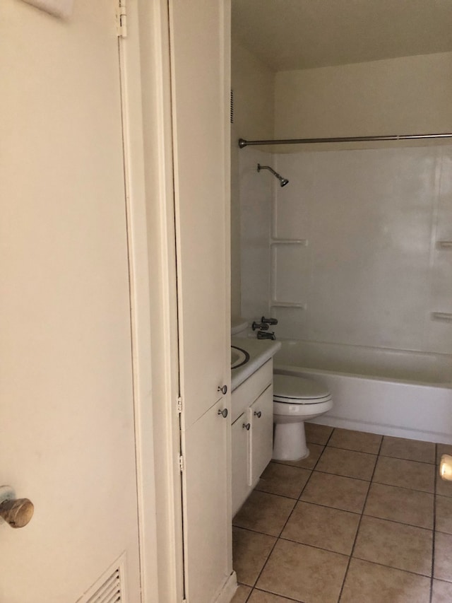 full bathroom featuring toilet,  shower combination, vanity, and tile patterned flooring