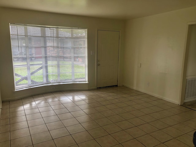 empty room featuring tile patterned floors