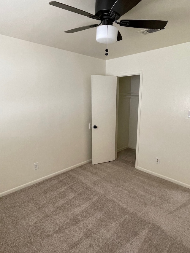 unfurnished bedroom with carpet flooring, a closet, and ceiling fan