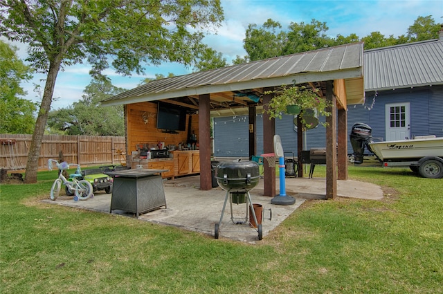 view of patio / terrace featuring grilling area and a fire pit