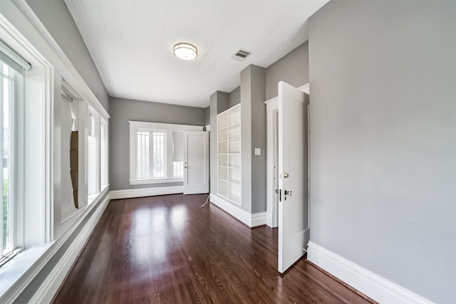 unfurnished room featuring dark hardwood / wood-style flooring