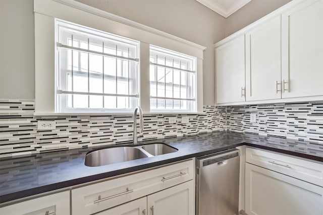 kitchen with a healthy amount of sunlight, decorative backsplash, white cabinetry, and stainless steel dishwasher