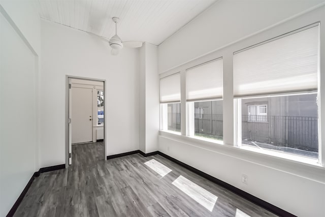 spare room featuring ceiling fan and dark hardwood / wood-style flooring