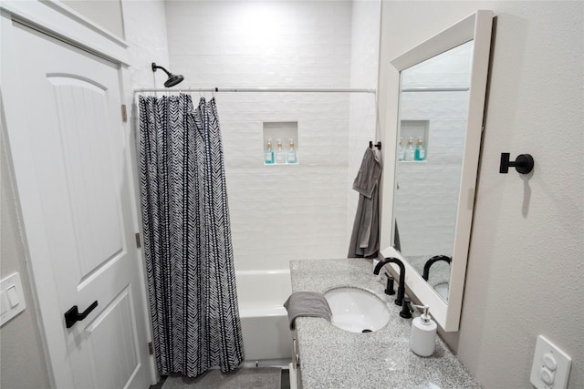 bathroom with shower / bath combination with curtain and vanity