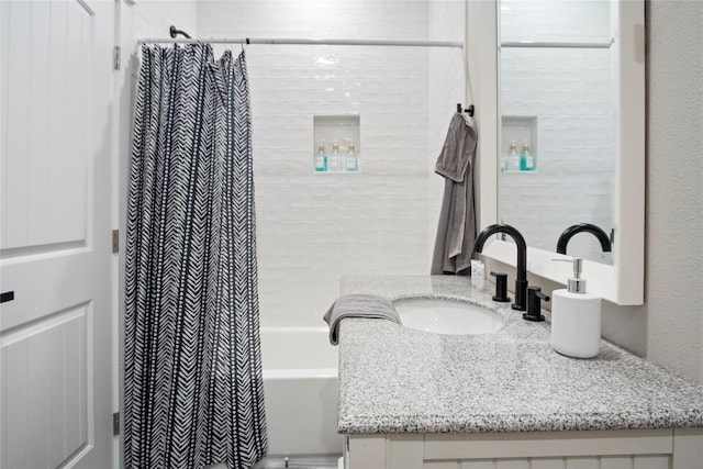 bathroom with vanity and shower / tub combo with curtain