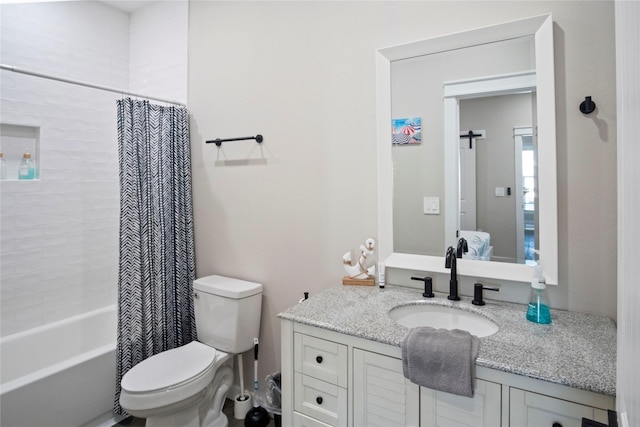 full bathroom featuring vanity, toilet, and shower / tub combo