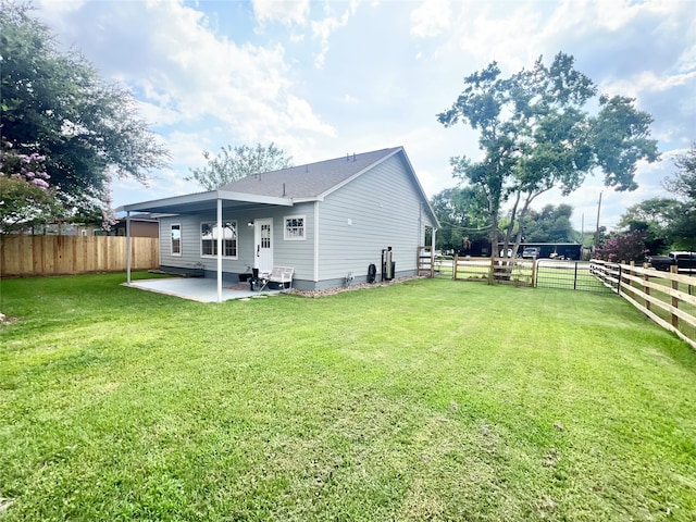 exterior space with a lawn and a patio