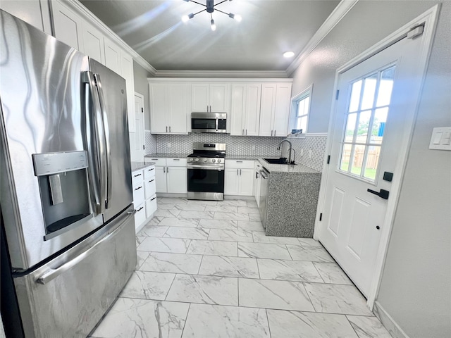 kitchen with decorative backsplash, white cabinets, light tile patterned floors, stainless steel appliances, and sink