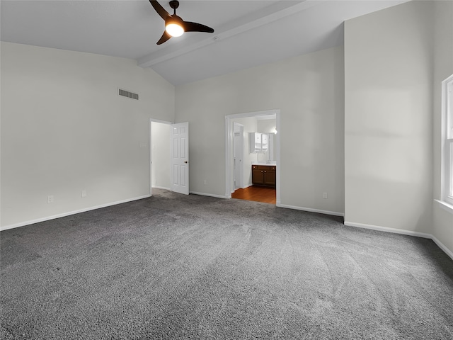 unfurnished bedroom with ceiling fan, ensuite bath, carpet floors, and beamed ceiling