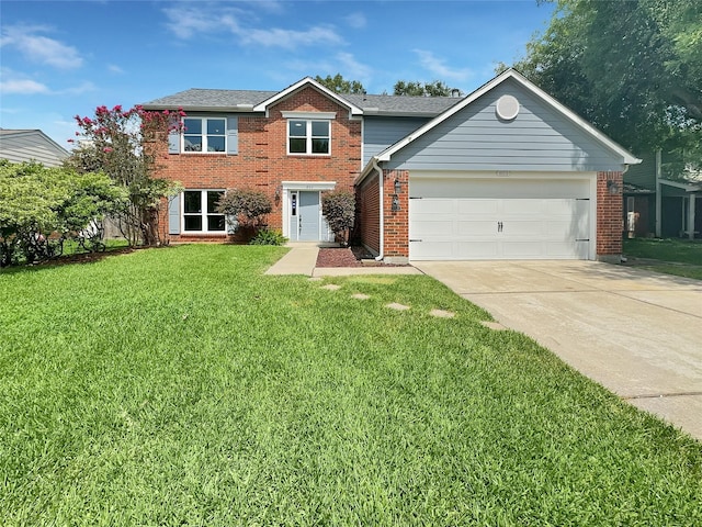 view of front of home with a front yard and a garage