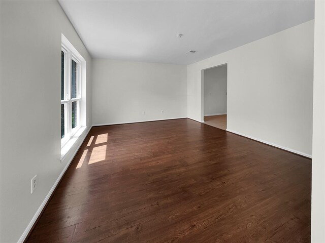 empty room featuring dark hardwood / wood-style floors