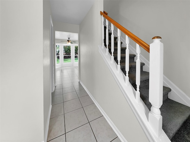 stairs with tile patterned flooring