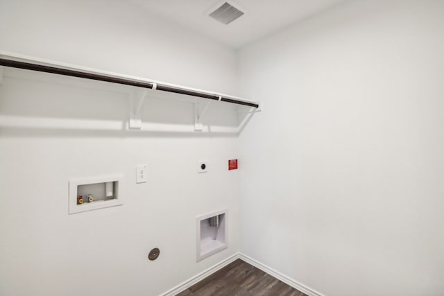 laundry area with dark hardwood / wood-style flooring, washer hookup, and hookup for an electric dryer