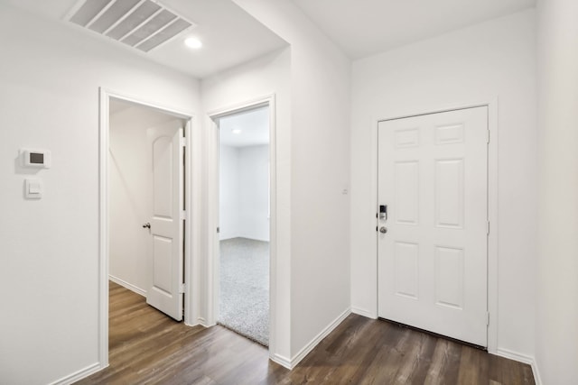 entryway with dark hardwood / wood-style floors