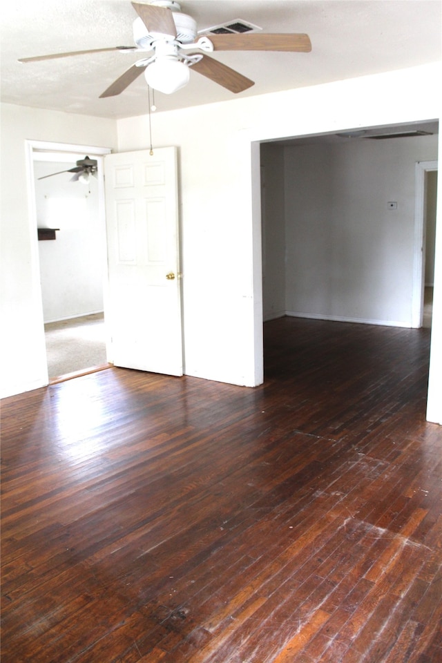 unfurnished room with dark hardwood / wood-style floors