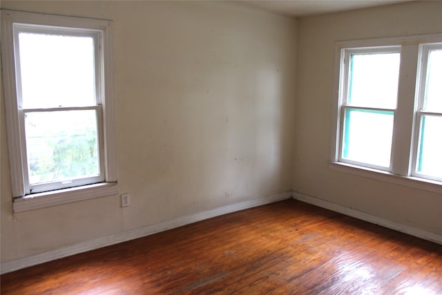 unfurnished room featuring dark hardwood / wood-style floors