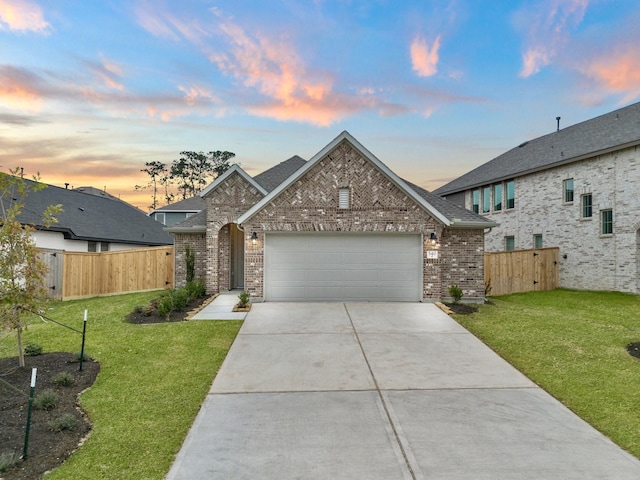 view of front of house with a lawn and a garage