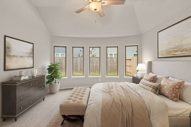 carpeted bedroom with lofted ceiling and ceiling fan