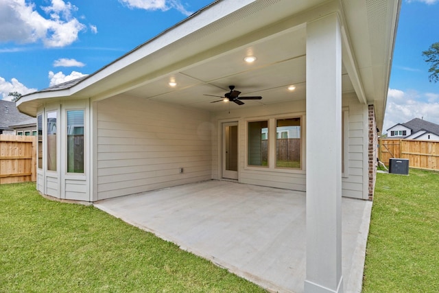 view of patio with central AC and ceiling fan