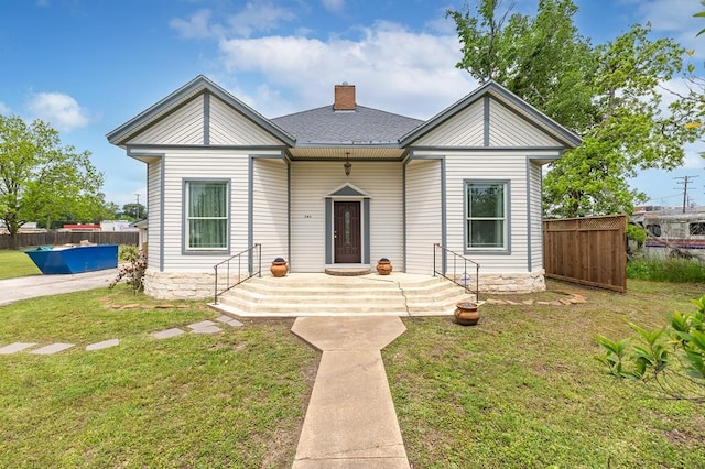 view of front of home with a front lawn