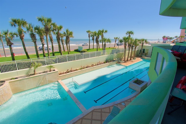 view of pool with a water view