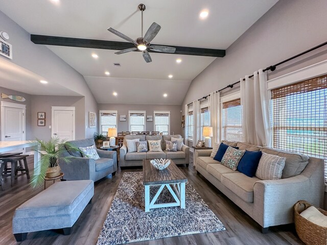 living room featuring lofted ceiling with beams, ceiling fan, and dark hardwood / wood-style flooring