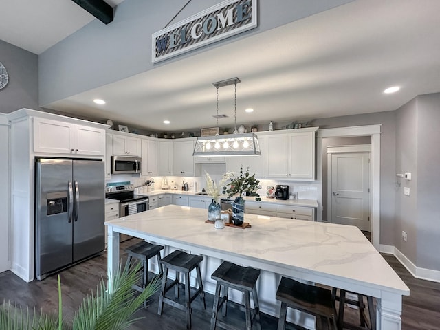 kitchen with dark wood-type flooring, white cabinetry, recessed lighting, appliances with stainless steel finishes, and baseboards