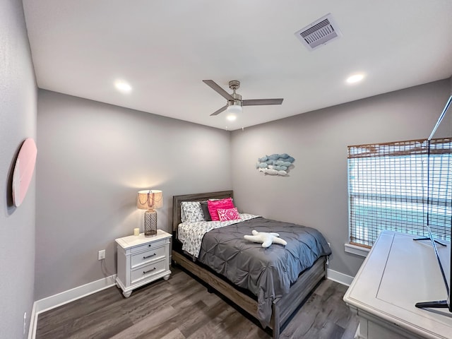 bedroom with a ceiling fan, wood finished floors, visible vents, baseboards, and recessed lighting