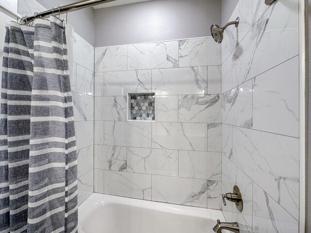 bathroom featuring shower / bath combination with curtain