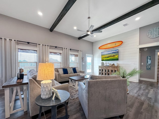 living room featuring ceiling fan, beam ceiling, and dark hardwood / wood-style flooring