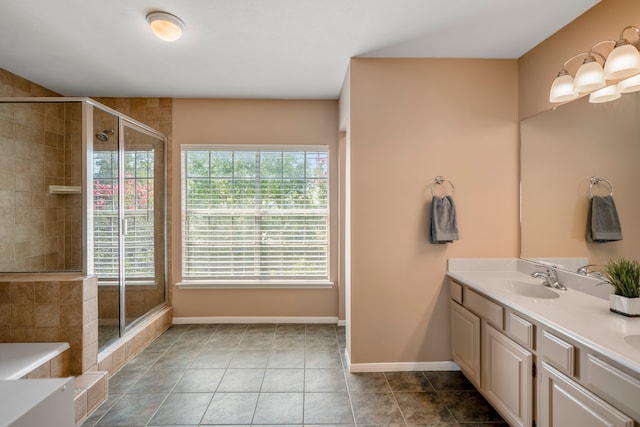 bathroom with tile patterned flooring, vanity, and a shower with shower door