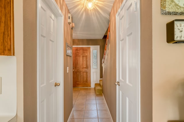 corridor with light tile patterned floors