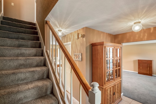 staircase with tile patterned flooring