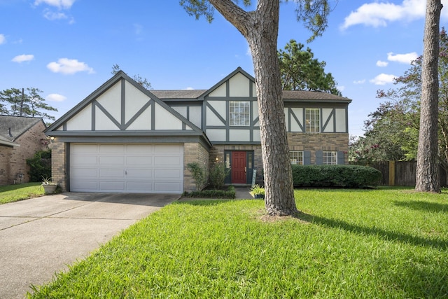 tudor home with a garage and a front lawn