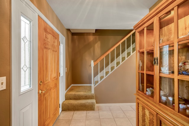 entryway featuring light tile patterned floors