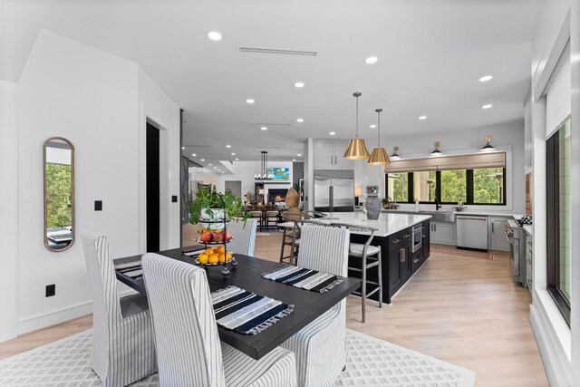 dining space with light wood-type flooring