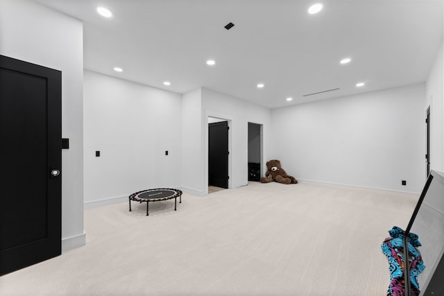 sitting room with light colored carpet