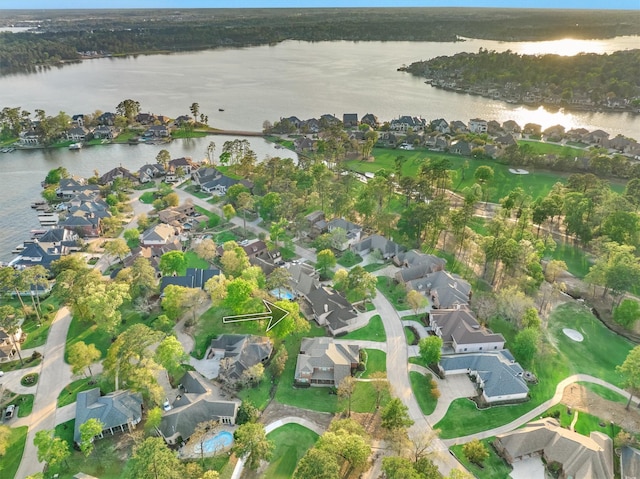 drone / aerial view featuring a residential view and a water view