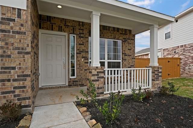 property entrance featuring covered porch