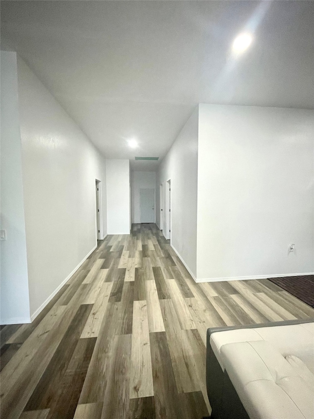 hall with hardwood / wood-style flooring