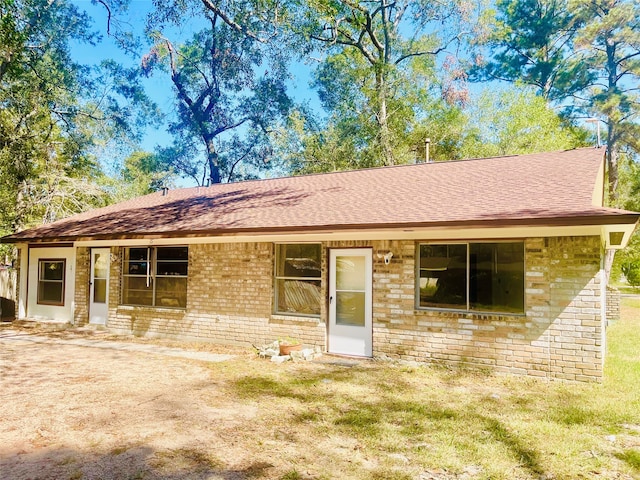 ranch-style house with a front lawn