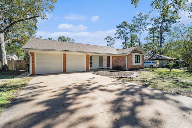 ranch-style house featuring a garage