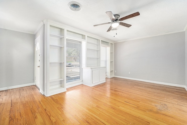 unfurnished bedroom with ceiling fan, light hardwood / wood-style floors, ornamental molding, and a textured ceiling