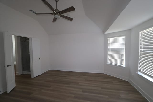 unfurnished room featuring ceiling fan, vaulted ceiling, and dark hardwood / wood-style flooring