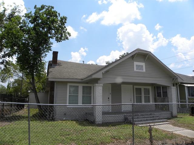 bungalow-style house with a porch and a front yard