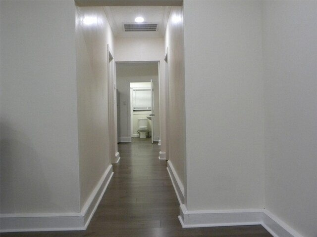 corridor featuring dark hardwood / wood-style flooring