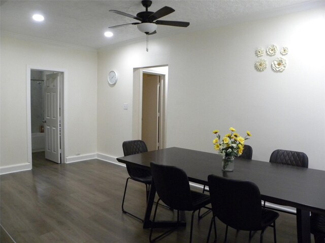 dining room with ceiling fan, dark hardwood / wood-style flooring, and a textured ceiling